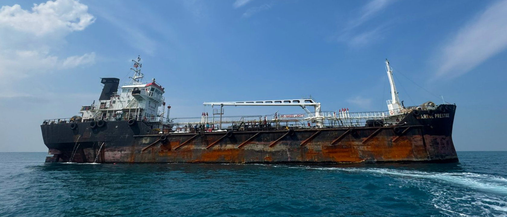 Two beakers containing a yellow liquid being stirred.